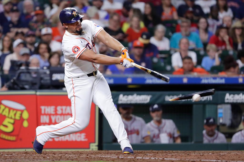 Astros batter Jose Abreu breaks his bat as he connects against the Atlanta Braves during the seventh inning of a baseball game Monday, April 15, 2024.