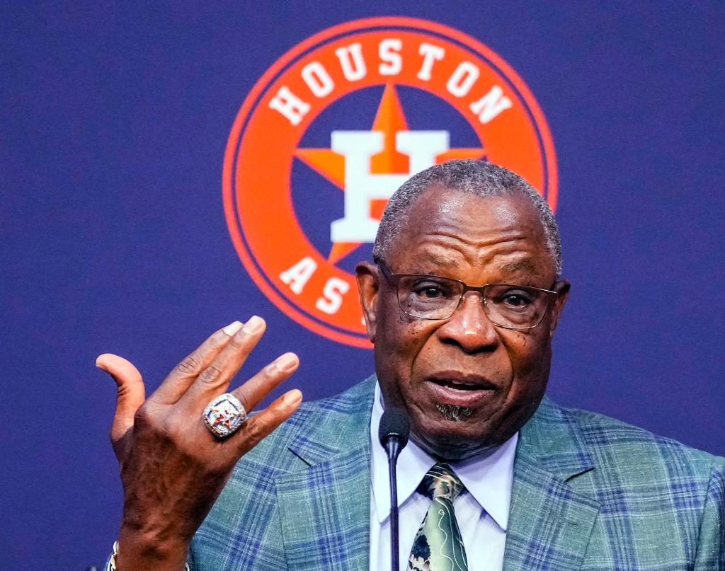 Dusty Baker holds up his Astros World Series ring as he announces his retirement on Oct. 26, 2023.