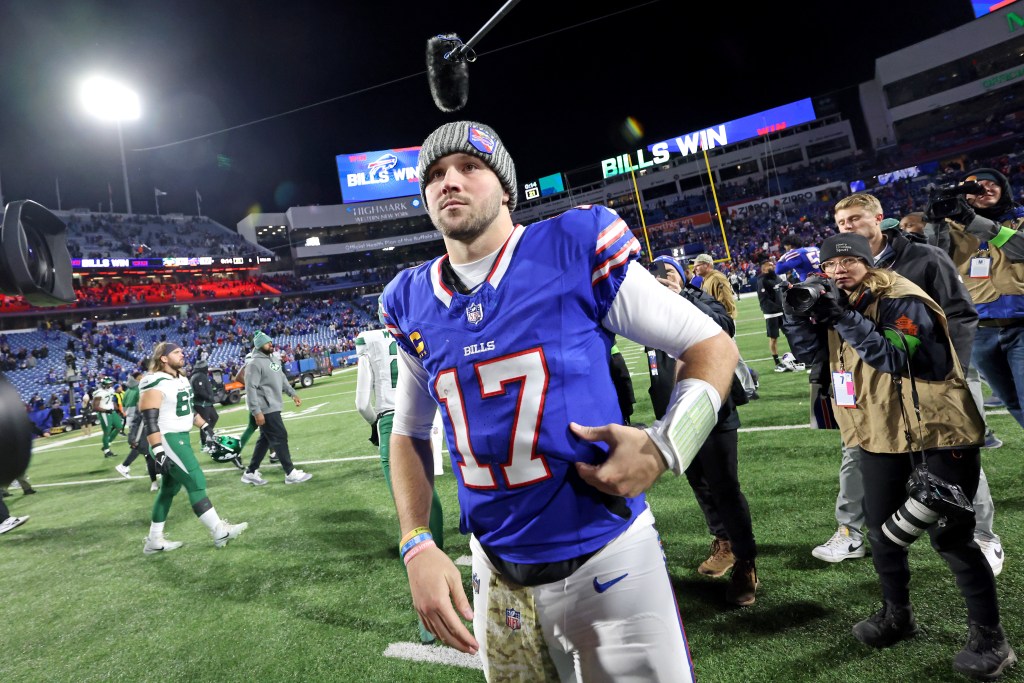 Josh Allen #17 of the Buffalo Bills walks off the field at the end of the fourth quarter. 