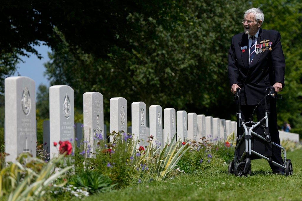 Normandy veteran Jack Hemmings visits the Bayeux cemetery on the 80th anniversary of D-Day in Bayeux, France, Wednesday, June 5, 2024.