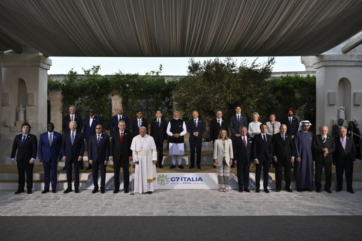 Pope Francis poses with the G7 heads of State, Olaf Scholz, German Chancellor, Justin Trudeau, Prime Minister of Canada, Emmanuel Macron, President of France, Giorgia Meloni, Italy's Prime Minister, Joe Biden, President of the United States, Fumio Kishida, Prime Minister of Japan, Rishi Sunak, Prime Minister of the United Kingdom and heads of delegation of Outreach countries and Charles Michel, President of the European Council and Ursula von der Leyen, President of the European Commission for a family photo on day two of the 50th G7 summit at Borgo Egnazia on June 14, 2024 in Fasano, Italy