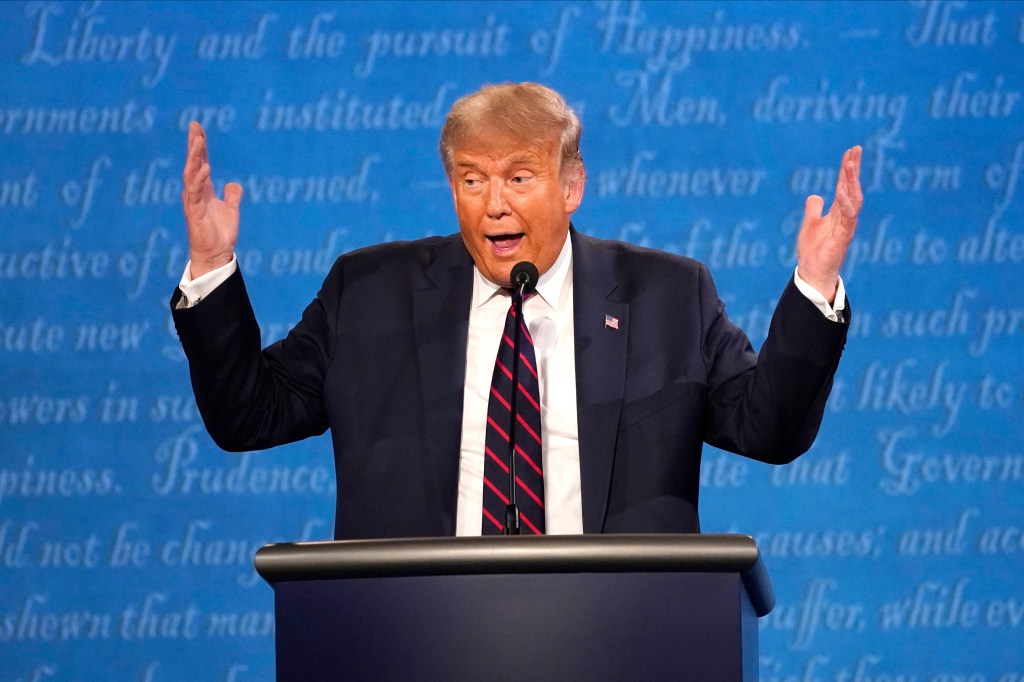 Donald Trump speaking at a podium during the 2020 presidential debate at Case Western University and Cleveland Clinic
