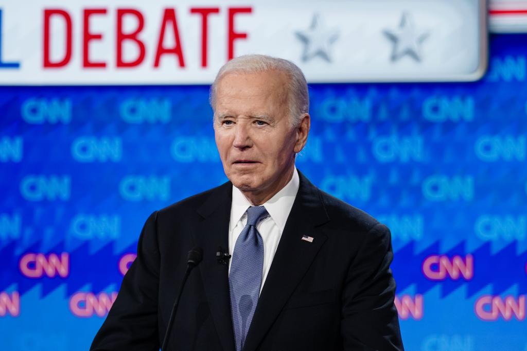 President Joe Biden standing on the stage during a break in the CNN presidential election debate in Atlanta, Georgia, on June 27, 2024.
