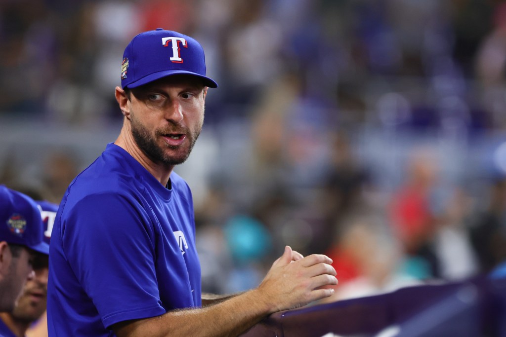 Max Scherzer (31) looks on from inside the dugout against the Miami Marlins at loanDepot Park. 