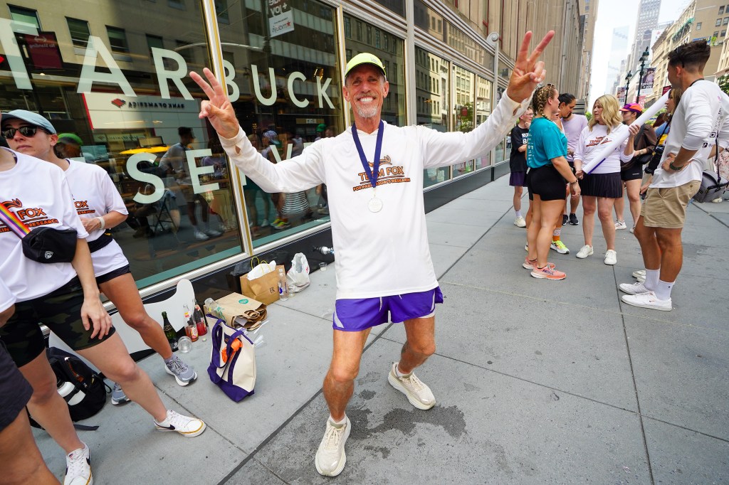 Mark Backes, 61, at Empire State Building after he ran from California to New York