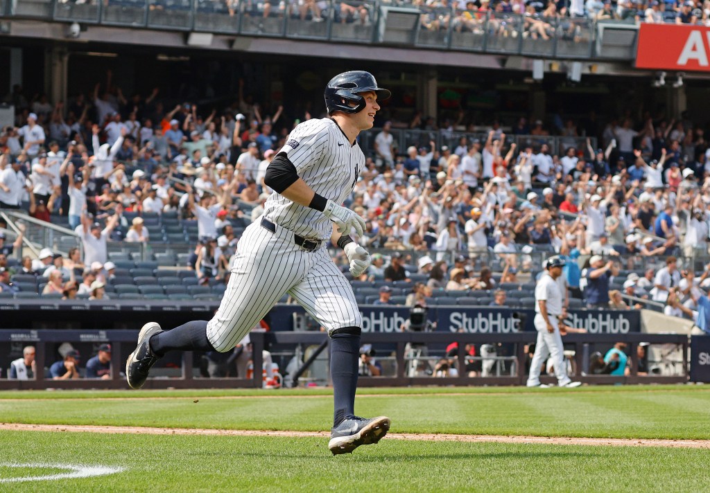 Ben Rice #93 rounds the bases on his three-run homer during in the 7th inning.