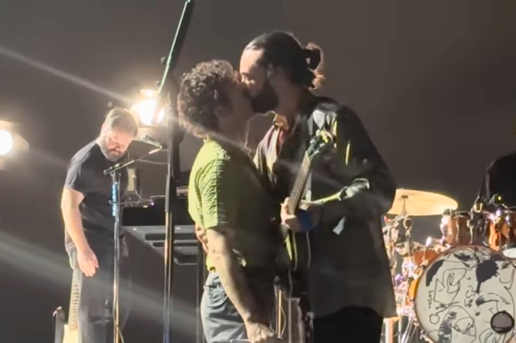 The 1975 front man Matty Healy kisses bassist Ross MacDonald onstage in Malaysia in July 2023