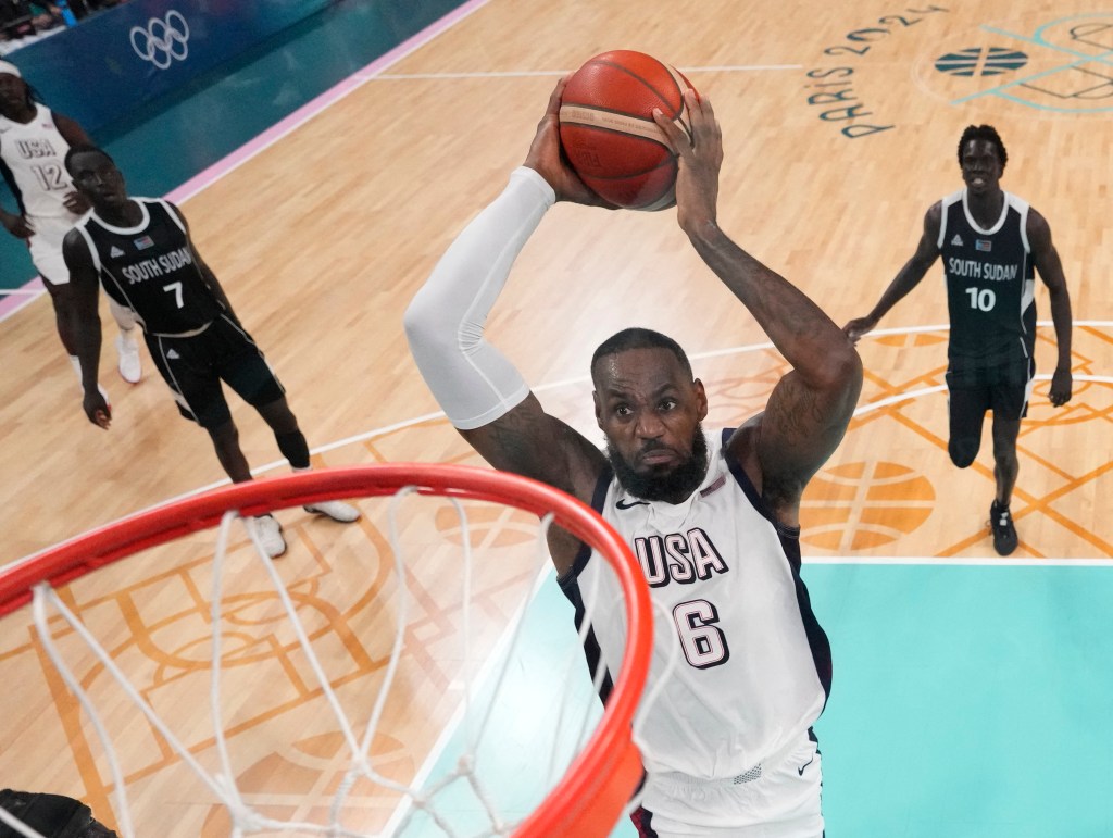 LeBron James dunks against South Sudan at the Olympics on July 31, 2024.