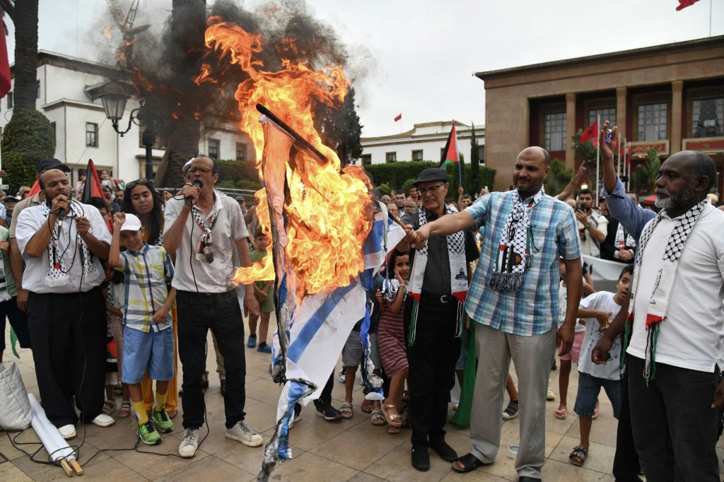 Pro-Hams protesters burned the Israeli flag on Wednesday.