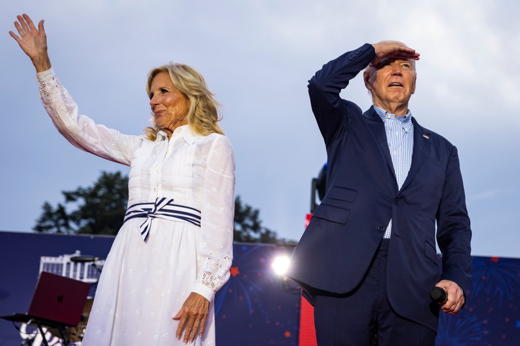 First Lady Jill Biden and President Joe Biden walk on stage during a 4th of July event on the South Lawn of the White House on July 4, 2024 in Washington, DC