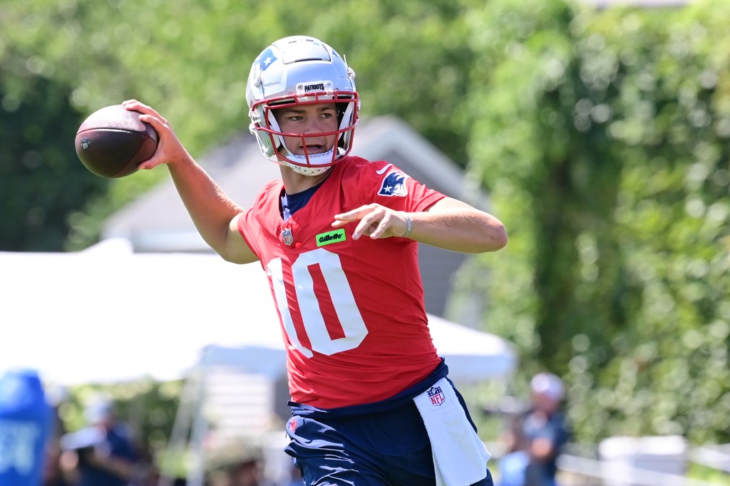 New England Patriots quarterback Drake Maye throwing a football during training camp at Gillette Stadium