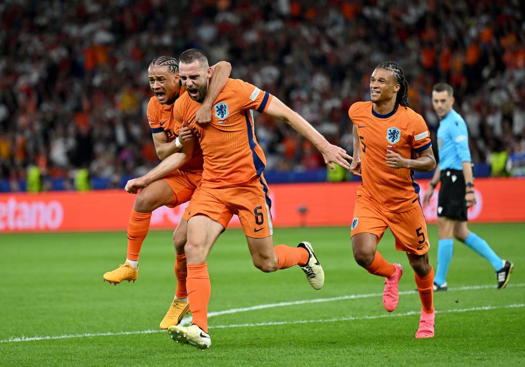 Stefan de Vrij and Xavi Simons of the Netherlands football team celebrating their first goal during the UEFA EURO 2024 quarter-final match against Türkiye in Berlin, Germany