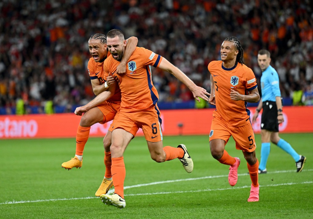 Stefan de Vrij and Xavi Simons of the Netherlands football team celebrating their first goal during the UEFA EURO 2024 quarter-final match against Türkiye in Berlin, Germany