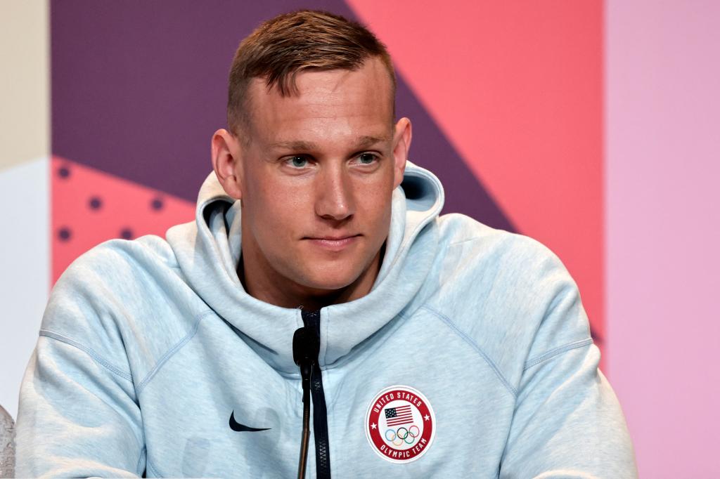 US swimmer Caeleb Dressel in a grey sweatshirt at World Aquatics Olympic press conference for Paris 2024 Olympic Games