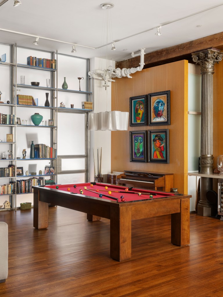 Hardwood floors and a pool table.  