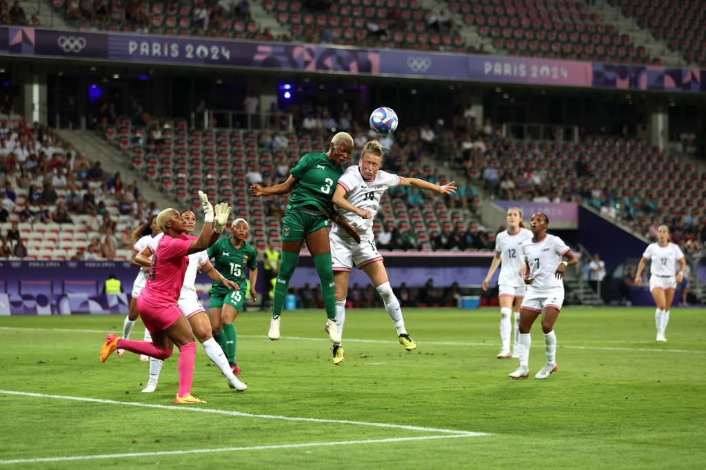 Lushomo Mweemba #3 of Zambia battles for a header with Emily Sonnett #14 of the U.S. in a Group B Olympics match in Nice, France on July 25, 2024.