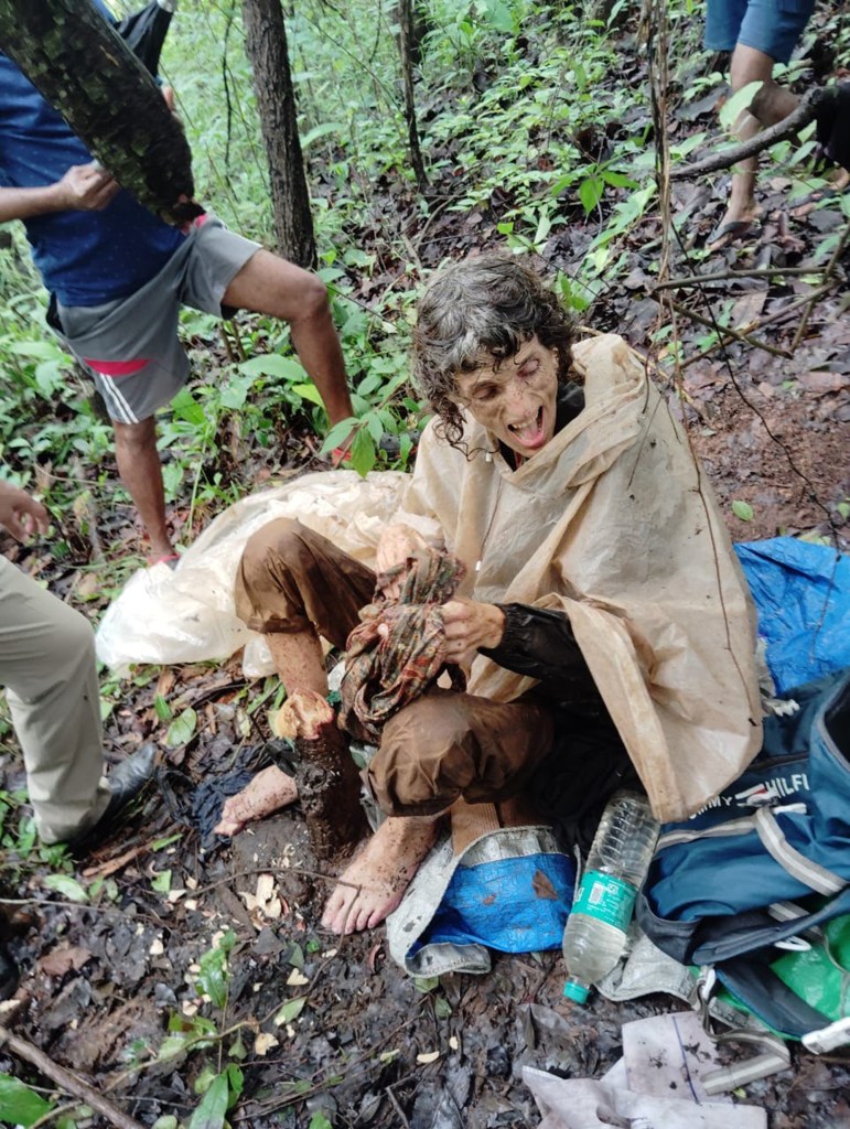 Kumar sitting in the forest.