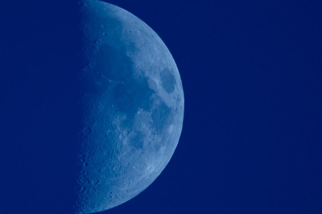 A close-up view of the half-moon at first quarter stage with 46% illumination, seen in Lecce, Italy on July 13, 2024.