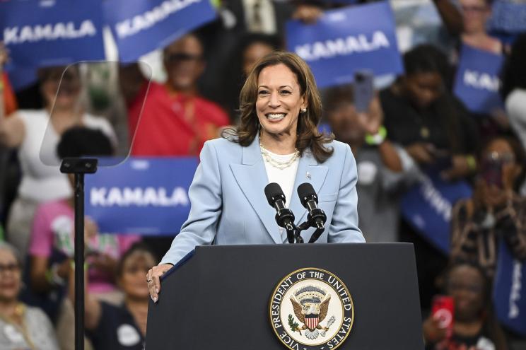 Vice President Kamala Harris reacts to the crowd as she takes the stage for a campaign rally at Georgia State Convocation Center in Atlanta, Georgia.