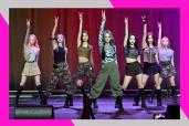 K-Pop girl group Dreamcatcher performs a choreographed dance in concert.