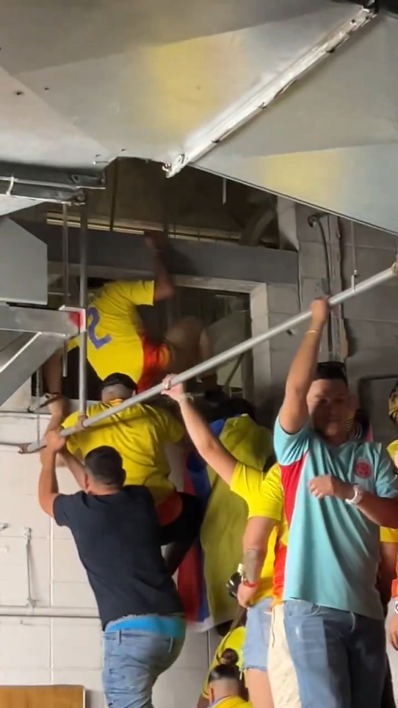 Hordes of fans are seen climbing through the vents at Rock Stadium in Miami to watch the Copa America final on Saturday.