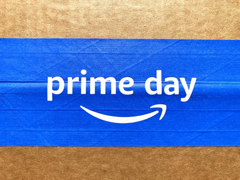 Amazon Prime Day sign, logo on blue tape of cardboard box advertises annual deal event exclusively for Amazon.com Prime members. - Seattle, Washington, USA - 2022