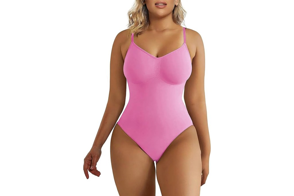 Laura Cremaschi wearing a pink swimsuit