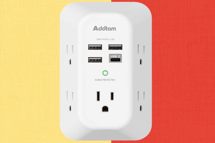 A white electrical outlet with multiple ports.