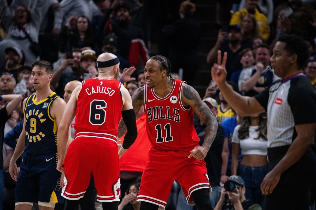 Alex Caruso and DeMar DeRozan celebrate in March.