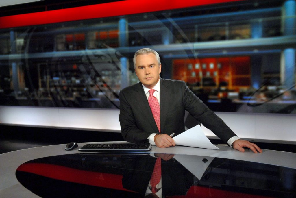 Huw Edwards, the top-earning news anchor, presenting in the N9 news studio for the Ten O'Clock news