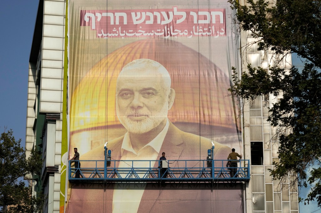 Iran set up a massive banner in memoriam to slain Hamas chief  Ismail Haniyeh in Palestine Square. 