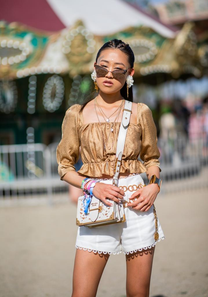 Woman at Coachella wearing festival wristbands