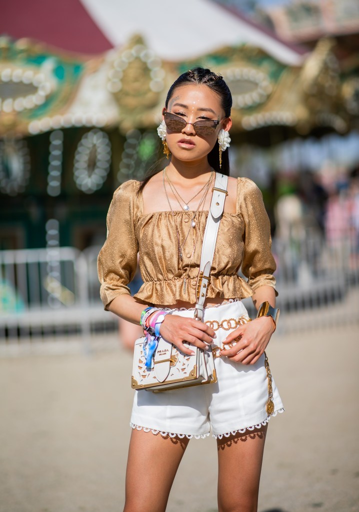 Woman at Coachella wearing festival wristbands 