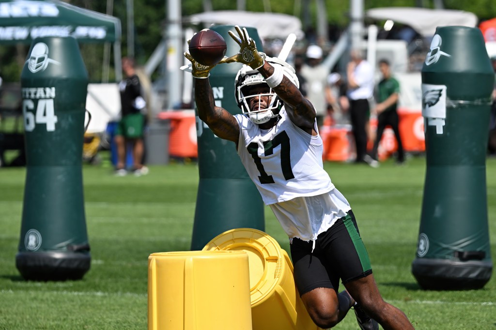 Jets wide receiver Malachi Corley (17) catches a pass during practice