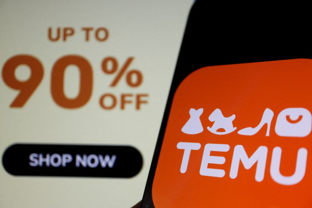 Temu logo on a mobile phone in front of a "90% off" sign.