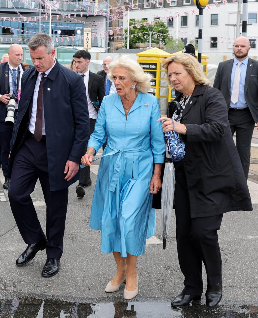 Her Majesty the Queen being subtly escorted off the premises by personal protection officers during the Jersey Expo Event at Weighbridge Place.