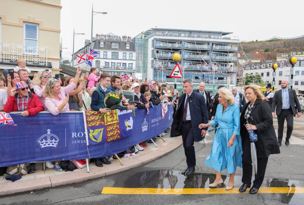 Her Majesty the Queen being escorted away due to a security issue while the King remains at the Jersey Expo Event, St Helier, United Kingdom.