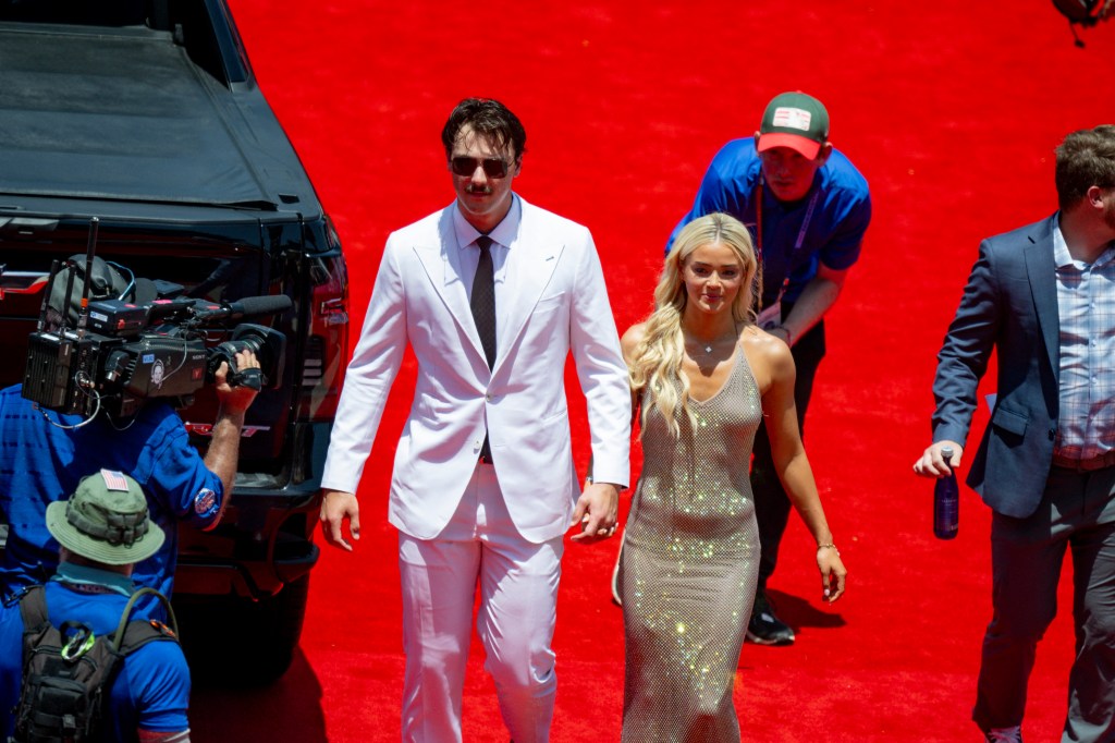 Paul Skenes of the Pittsburgh Pirates walks the red carpet with his girlfriend LSU gymnast Olivia Livvy Dunne before the 2024 MLB All-Star game at Globe Life Field. 