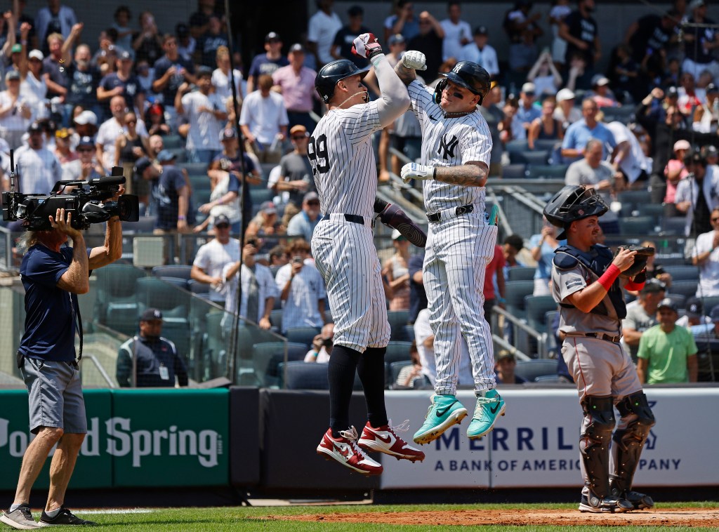 Yankees left fielder Alex Verdugo #24 and New York Yankees DH Aaron Judge #99 celebrate after  they score on Verdugo's two-run homer during the third inning.