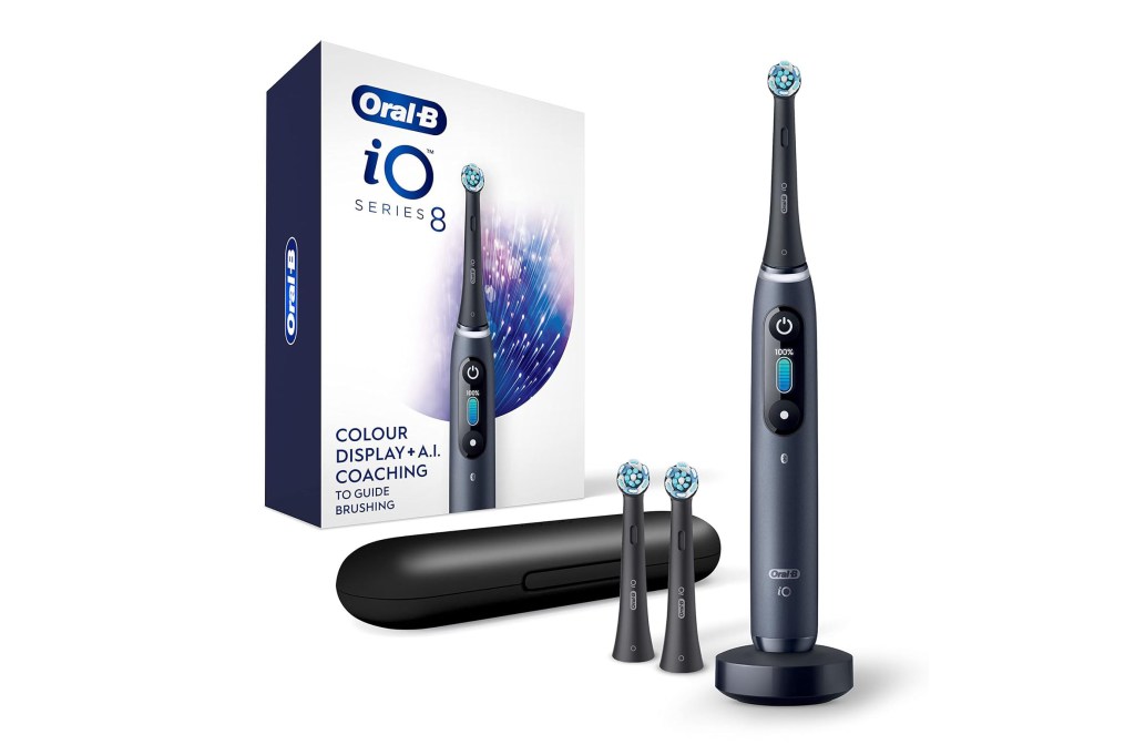 A black electric toothbrush with its box