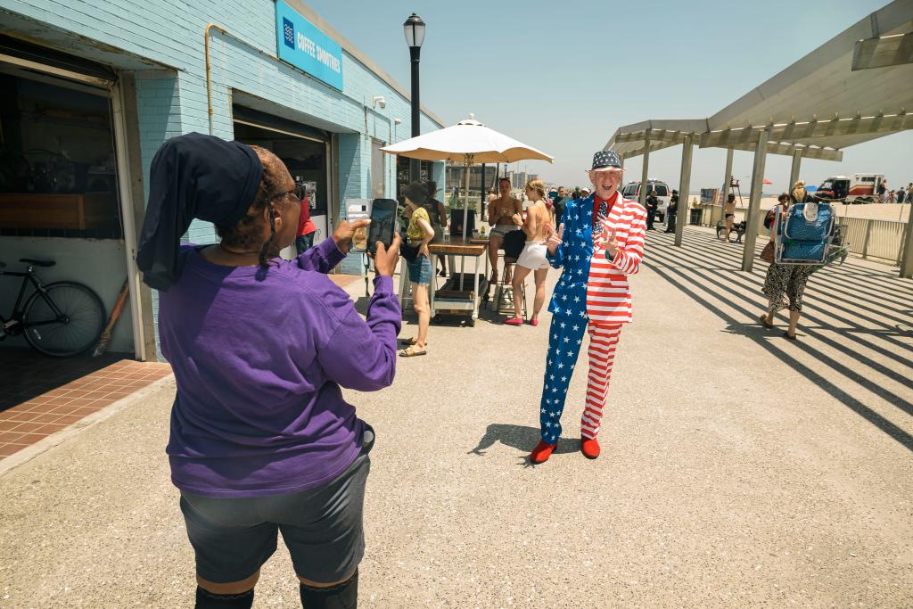 Owen Loof, the Best Dressed Man in Rockaway, standing by the boardwalk and beach at Rockaway Beach, Queens, NY