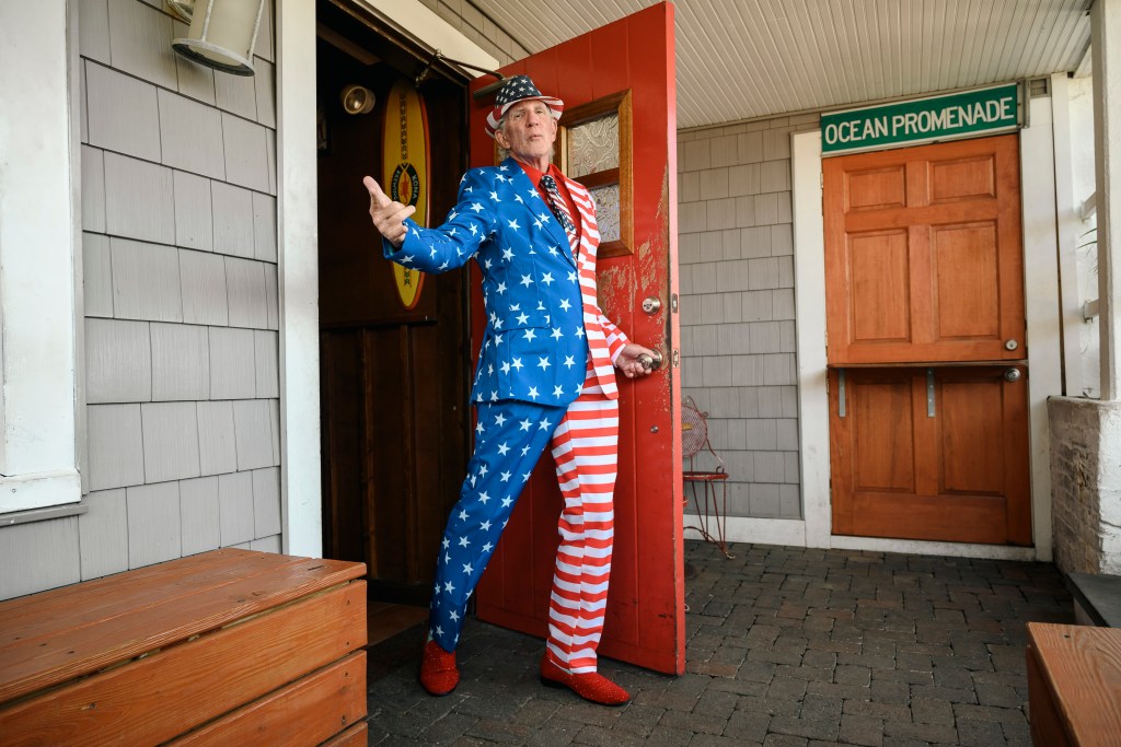 Owen Loof, best dressed man in Rockaway, wearing a blue suit and red and white striped pants at Connolly's bar, Queens, NY