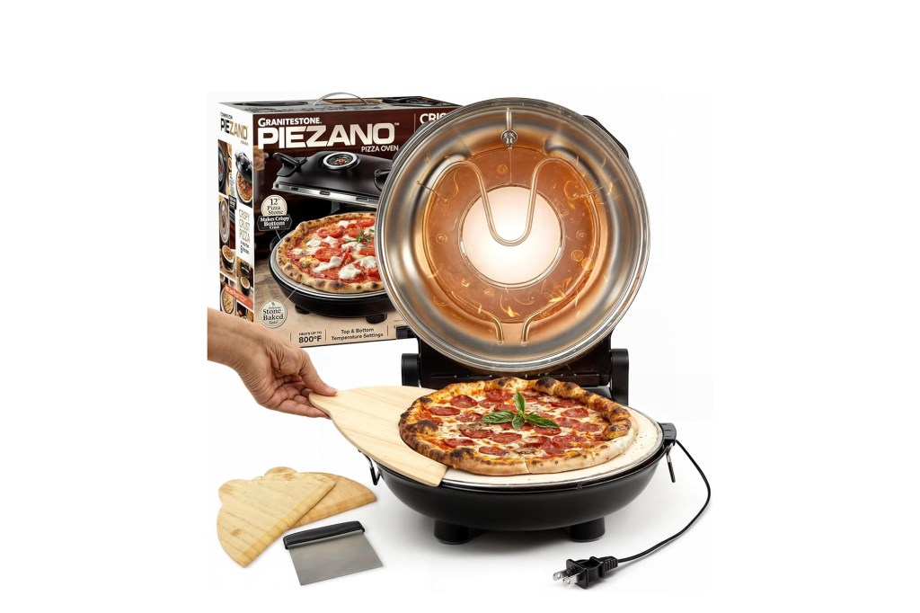 A pizza being cooked in a small pizza maker