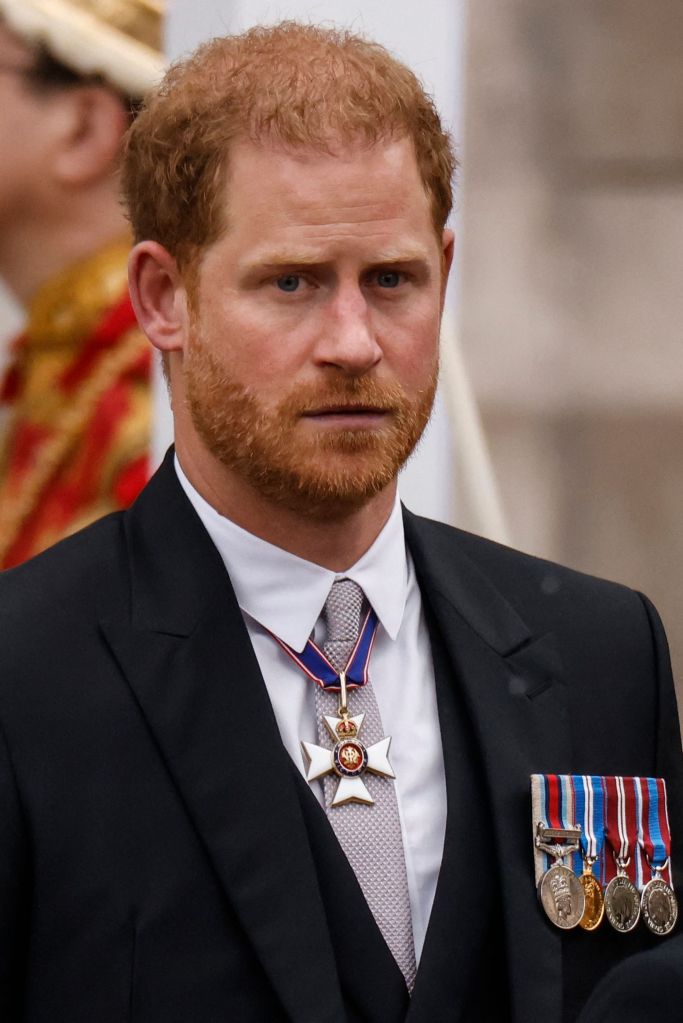 Prince Harry, Duke of Sussex leaves Westminster Abbey after the Coronation Ceremonies of Britain's King Charles III and Britain's Queen Camilla in central London on May 6, 2023. 