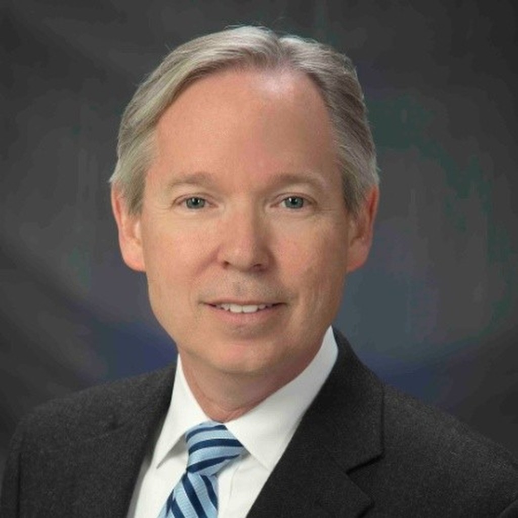 Kevin Cannard, a Movement Disorders specialist at Walter Reed National Military Medical Center, dressed in a suit and tie.