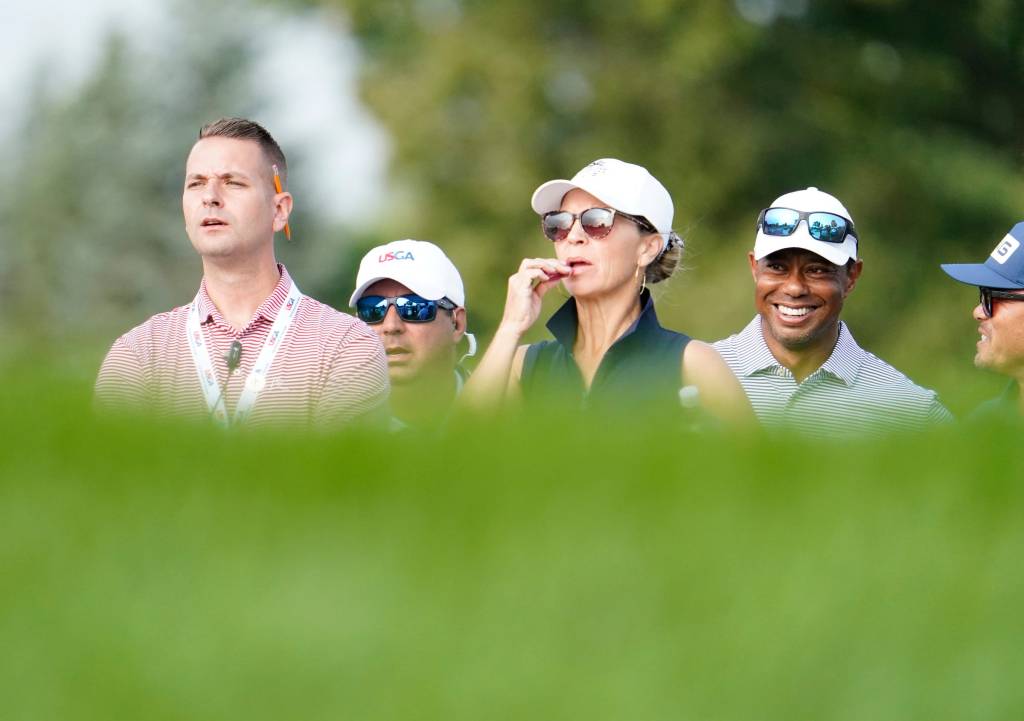 iger Woods looks on from right as his son Charlie Woods participates in the 76th U.S. Junior Amateur Championship