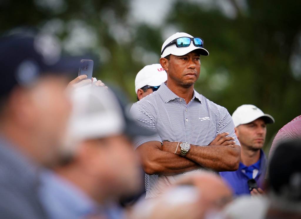 Tiger Woods watches his son Charlie tee off from No. 1 on the North Course during the 76th U.S. Junior Amateur Championship at Oakland Hills Country Club.