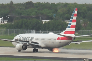 Terrifying moment plane's tire bursts into flames during takeoff.