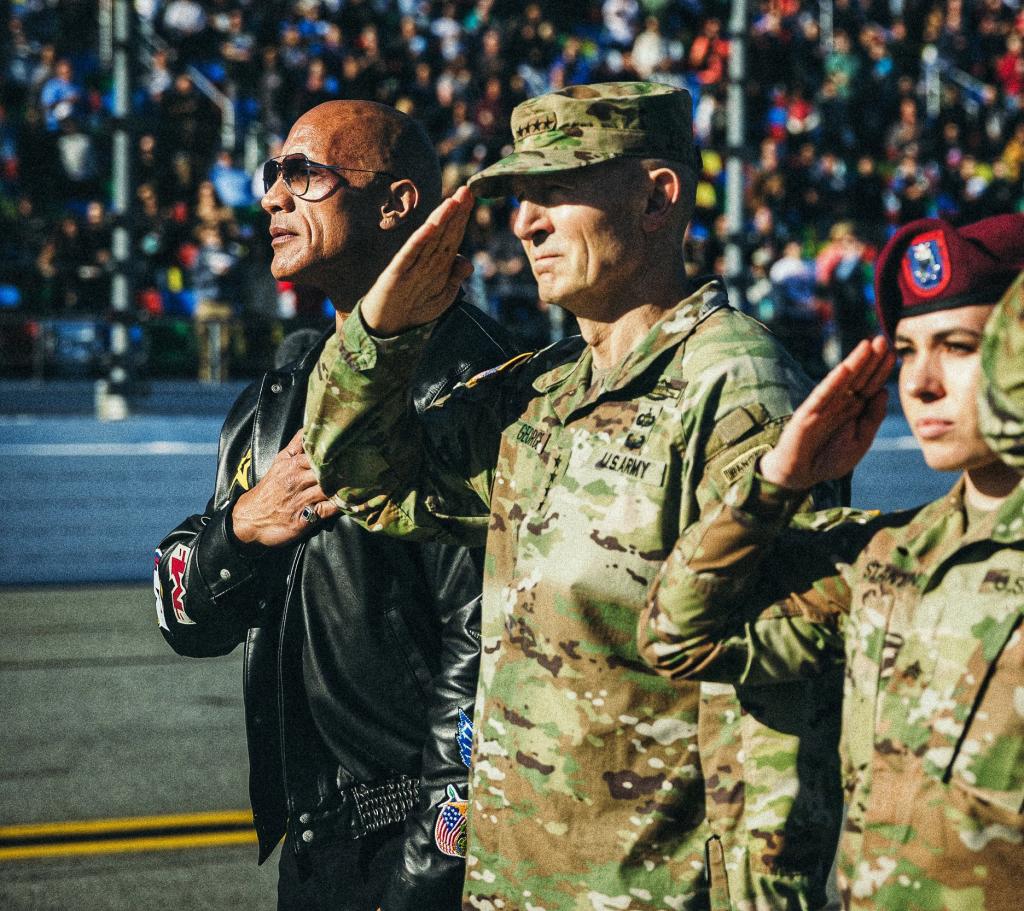 Johnson standing with Army soldiers.