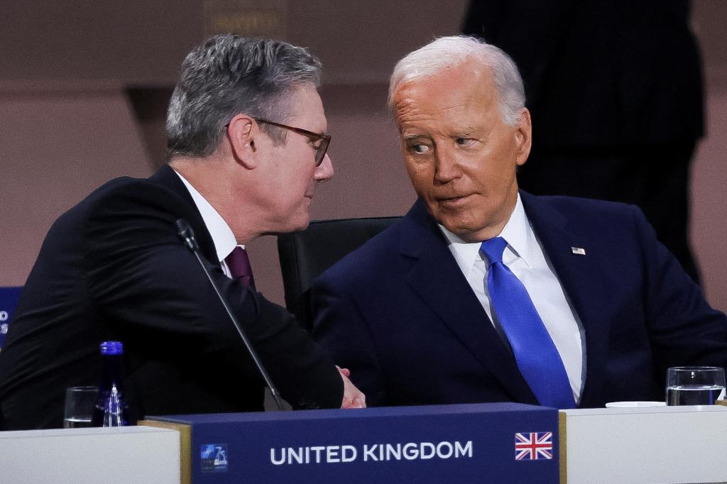 President Joe Biden looks at Britain's Prime Minister Keir Starmer at a meeting of the North Atlantic Council at the level of Heads of State and Government, Indo-Pacific and European Union during NATO's 75th anniversary summit in Washington, U.S., July 11, 2024.